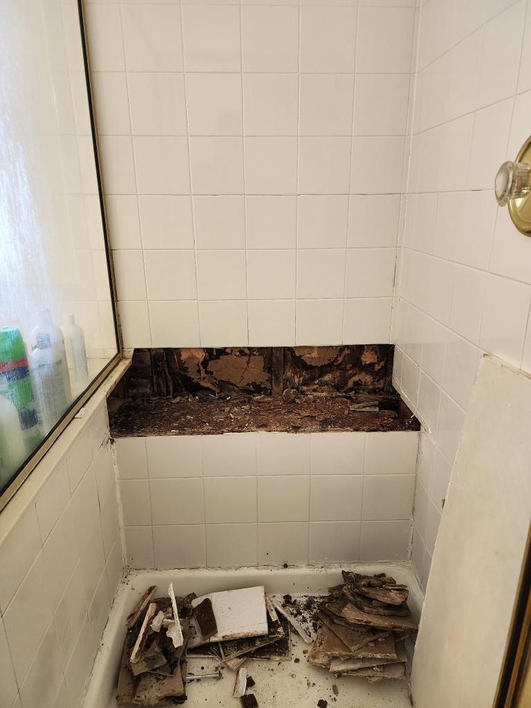 Shower bench with gaps where the warped bench let water in